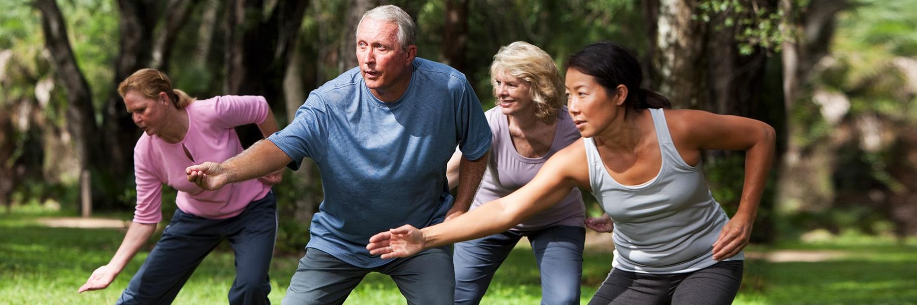 Aging Studies Minor group of adults exercises outside.